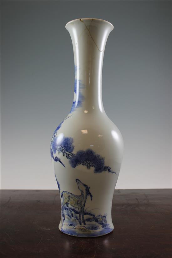 A Chinese underglaze blue and copper red crane and deer bottle vase, Kangxi six character mark, early 20th century, 39.5cm., neck rep